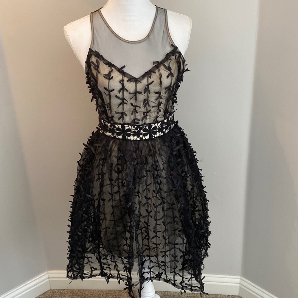 Black and sheer cocktail dress with tiny ribbons